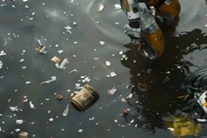 humanoid robot stands knee-deep in a dirty river and cleans up garbage